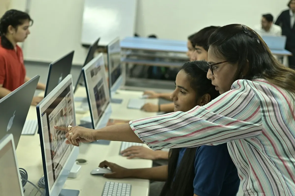 Students learning together in a computer classroom